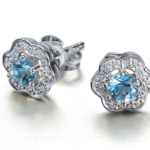 Aros Jolie Fleur Oro blanco 18 kts brillantes y topacio